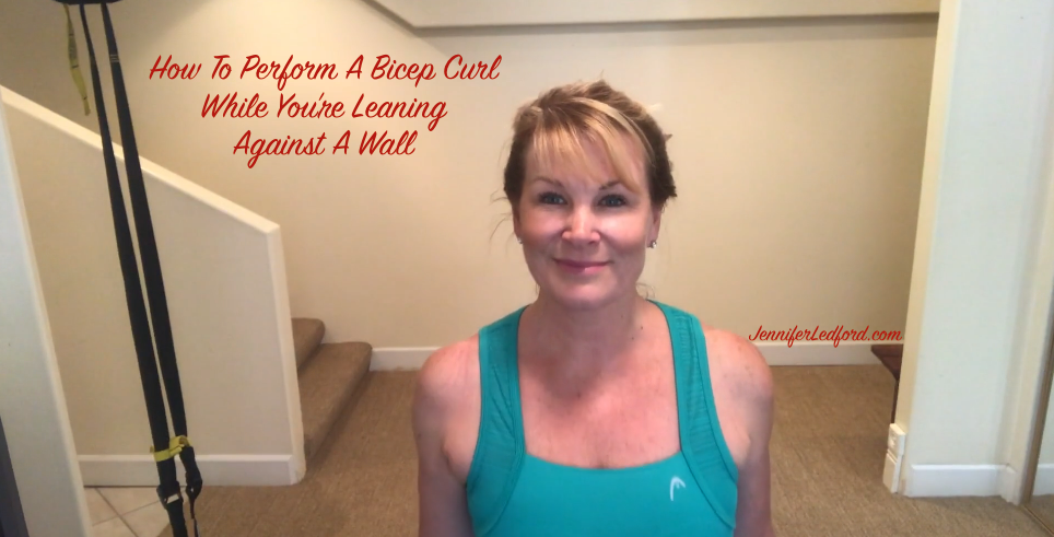 How To Perform A Bicep Curl While You're Leaning Against A Wall - Jennifer Ledford - Strengthen Your Arms